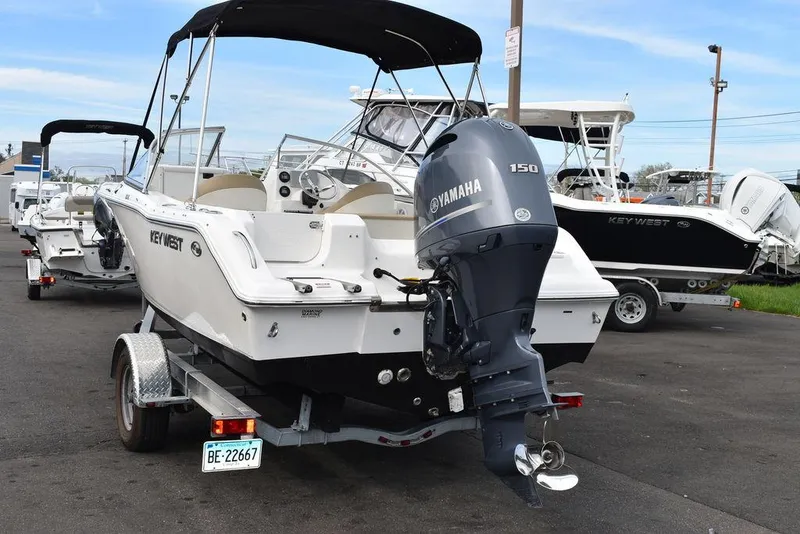 Slide: The Image of 2018 Key West 203DFS boat with Yamaha 150 engine on trailer. - 18
