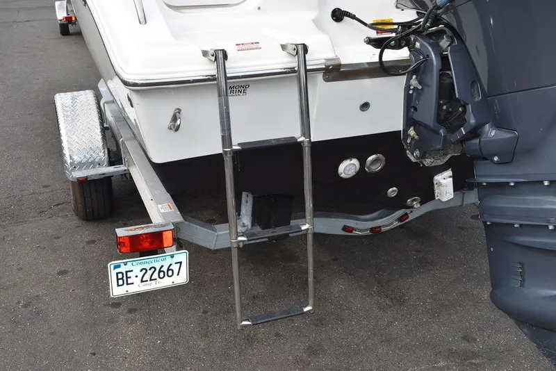 Slide: The Image of 2018 Key West 203DFS boat on trailer with ladder and outboard motor. - 19