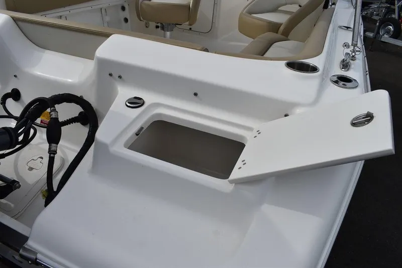 Slide: The Image of 2018 Key West 203DFS boat with open storage compartment and seating area. - 20