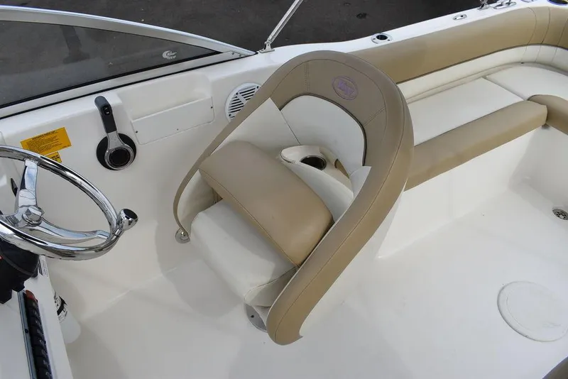 Slide: The Image of 2018 Key West 203DFS boat interior with beige and white seating. - 26