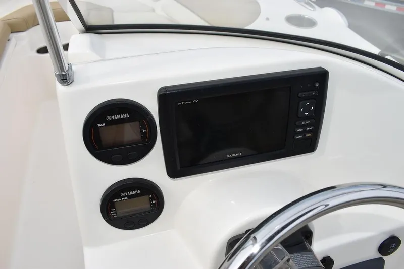 Slide: The Image of 2018 Key West 203DFS boat dashboard with Garmin display and Yamaha gauges. - 29