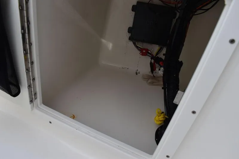 Slide: The Image of 2018 Key West 203DFS storage compartment with wiring and electrical components. - 42