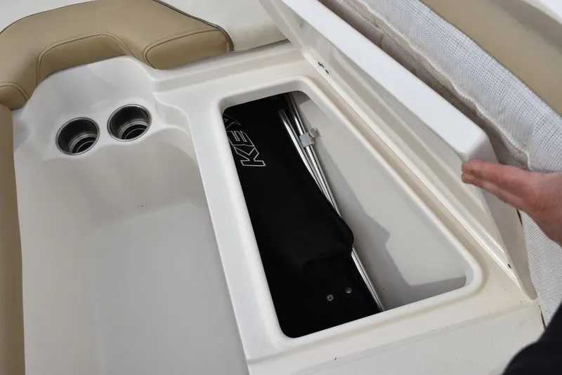 Slide: The Image of 2018 Key West 203DFS boat storage compartment with cup holders and cushioned seating. - 45