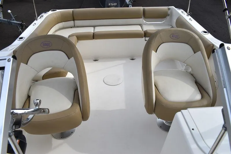 Slide: The Image of 2018 Key West 203DFS boat interior with beige and white seating. - 47