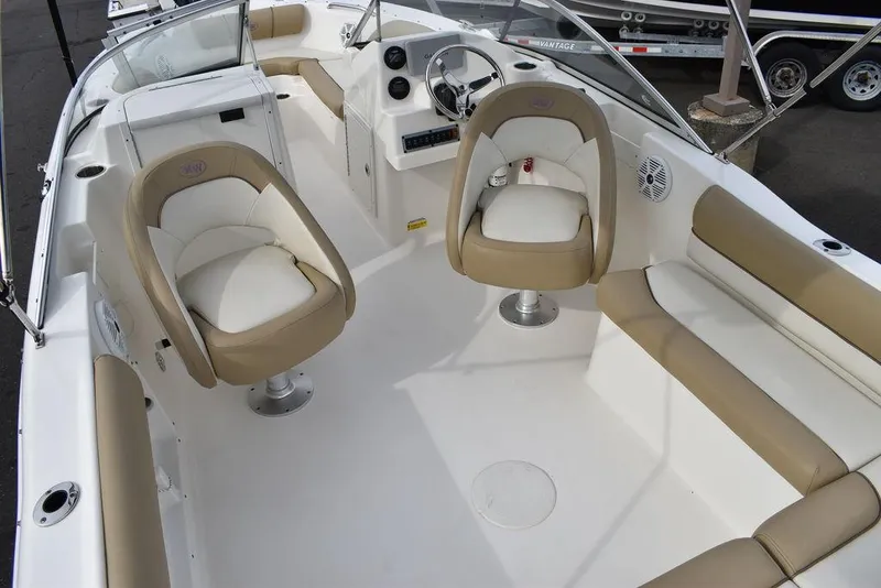 Slide: The Image of 2018 Key West 203DFS boat interior with beige and white seating. - 48