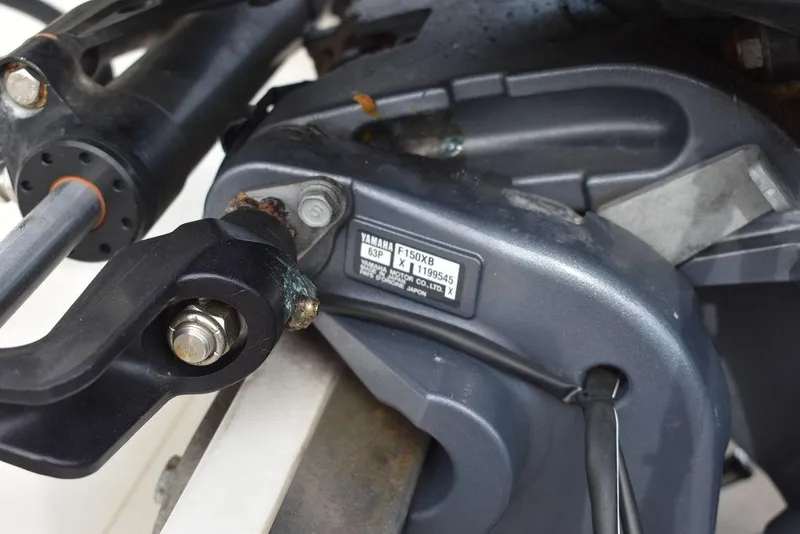 Slide: The Image of Close-up of a 2018 Key West 203DFS boat engine component. - 49