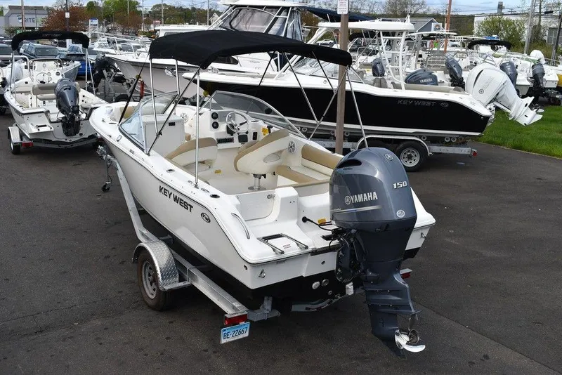 Slide: The Image of 2018 Key West 203DFS boat with Yamaha 150 engine on trailer in marina. - 5