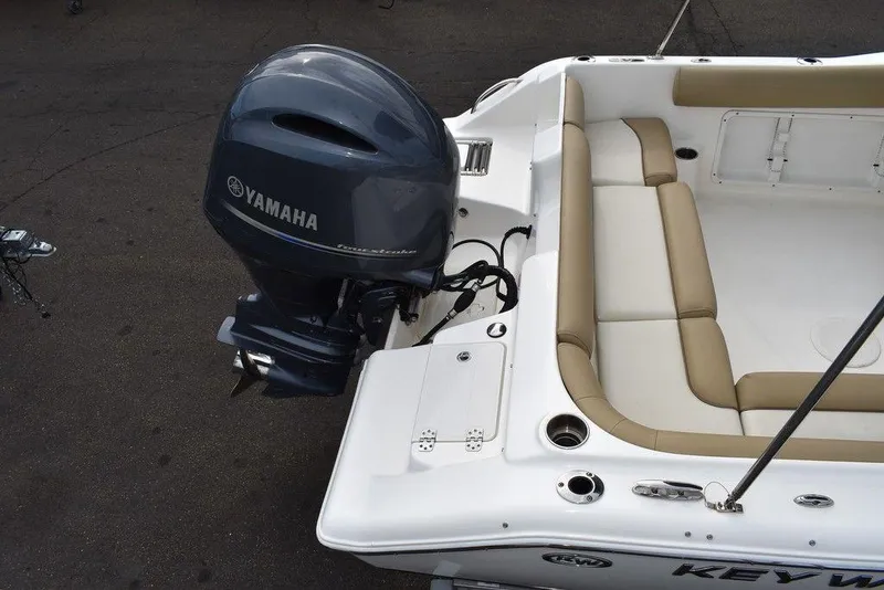 Slide: The Image of 2018 Key West 203DFS boat with Yamaha outboard motor and beige seating. - 9