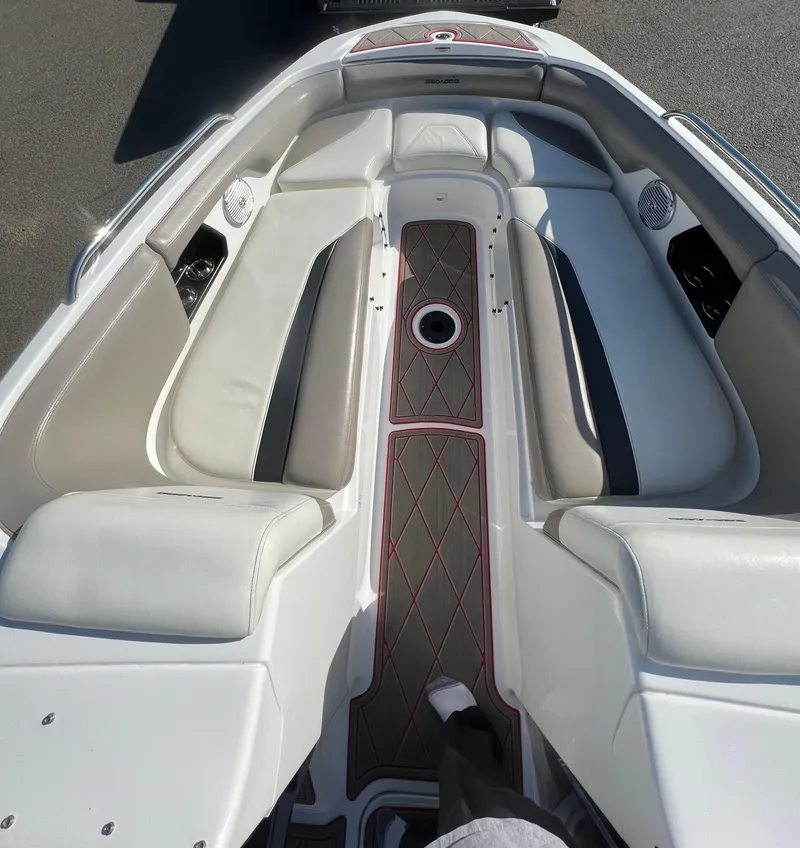 Slide: The Image of 2011 Sea-Doo 230 Wake (510 hp) boat interior with cushioned seating and deck. - 10
