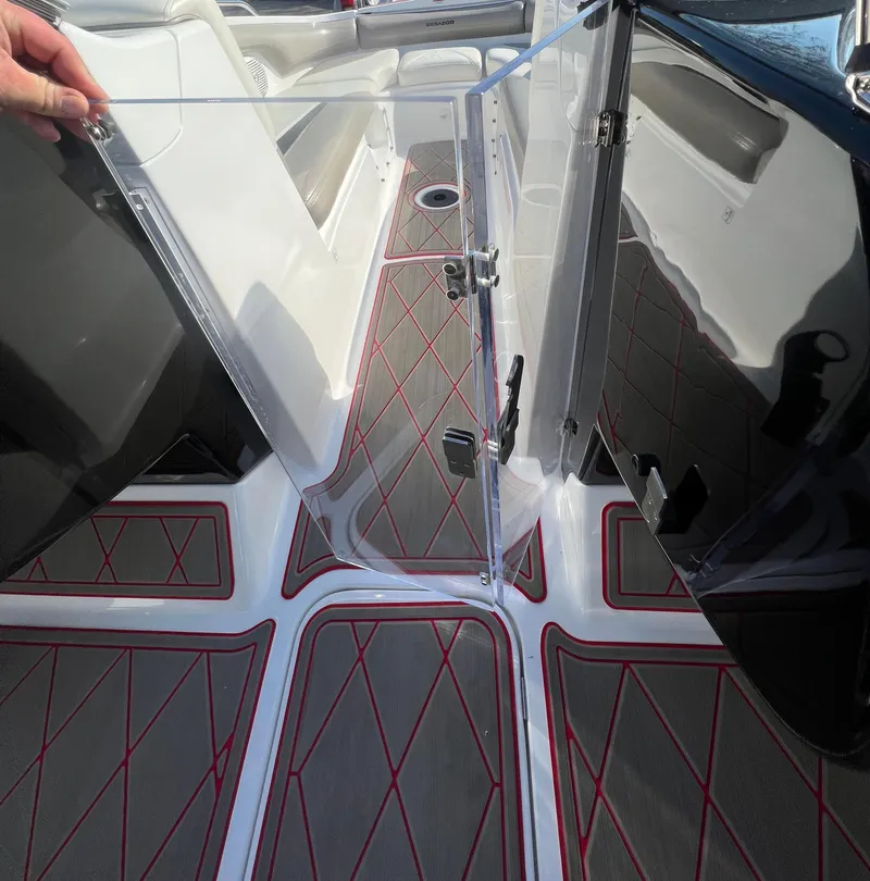 Slide: The Image of 2011 Sea-Doo 230 Wake (510 hp) boat interior with red and gray flooring. - 11