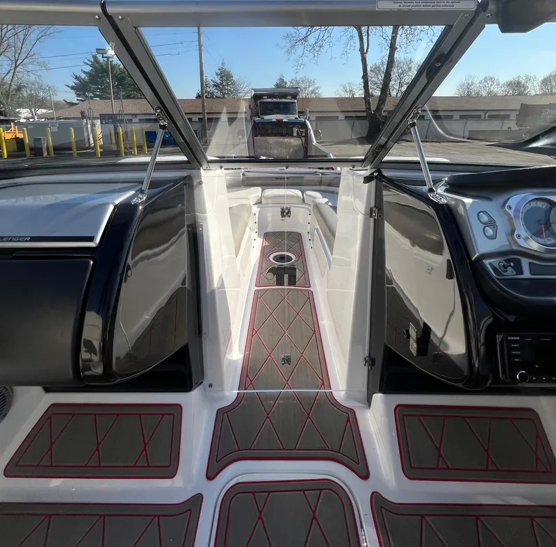 Slide: The Image of Interior of a 2011 Sea-Doo 230 Wake boat, featuring sleek design and modern dashboard. - 12