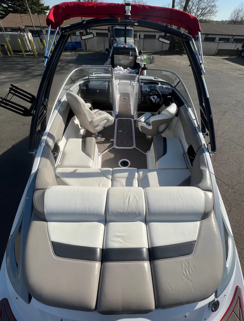 Slide: The Image of 2011 Sea-Doo 230 Wake (510 hp) boat interior with seating and steering console. - 15