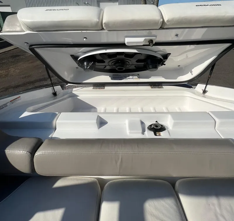 Slide: The Image of 2011 Sea-Doo 230 Wake (510 hp) boat interior with open storage compartment. - 16