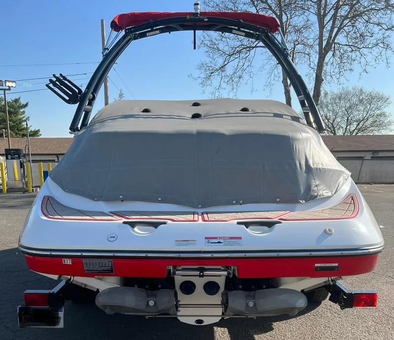 Slide: The Image of 2011 Sea-Doo 230 Wake (510 hp) boat rear view with cover and wakeboard tower. - 21