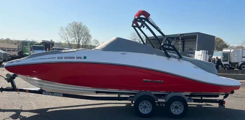 Slide: The Image of 2011 Sea-Doo 230 Wake (510 hp) boat on a trailer. - 22