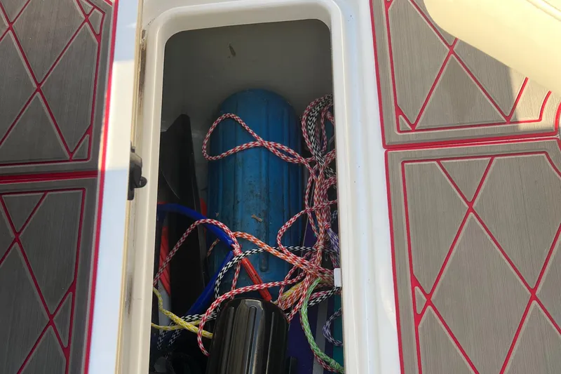 Slide: The Image of Storage compartment of 2011 Sea-Doo 230 Wake with ropes and equipment. - 27