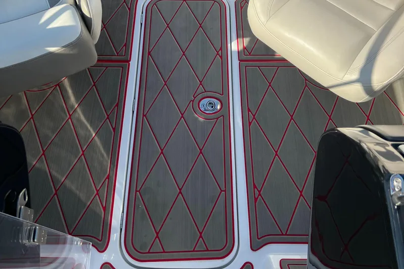 Slide: The Image of 2011 Sea-Doo 230 Wake boat interior flooring with red diamond pattern. - 28