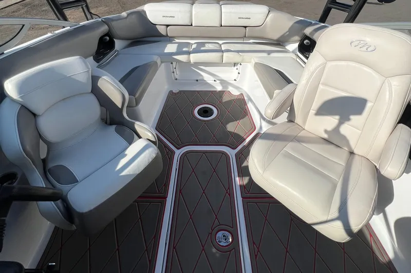 Slide: The Image of 2011 Sea-Doo 230 Wake (510 hp) boat interior with white leather seats and patterned flooring. - 31