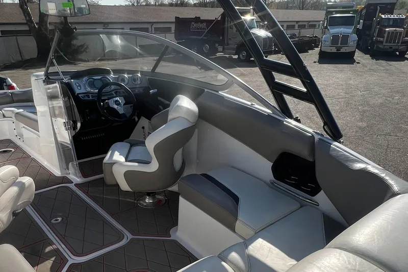 Slide: The Image of 2011 Sea-Doo 230 Wake (510 hp) boat interior with captain's chair and dashboard. - 32
