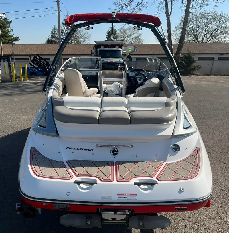 Slide: The Image of 2011 Sea-Doo 230 Wake (510 hp) boat, rear view, parked on pavement. - 4