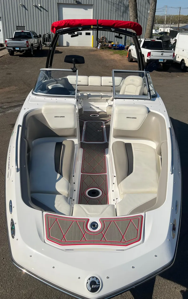 Slide: The Image of 2011 Sea-Doo 230 Wake (510 hp) boat with red canopy and white seating. - 8