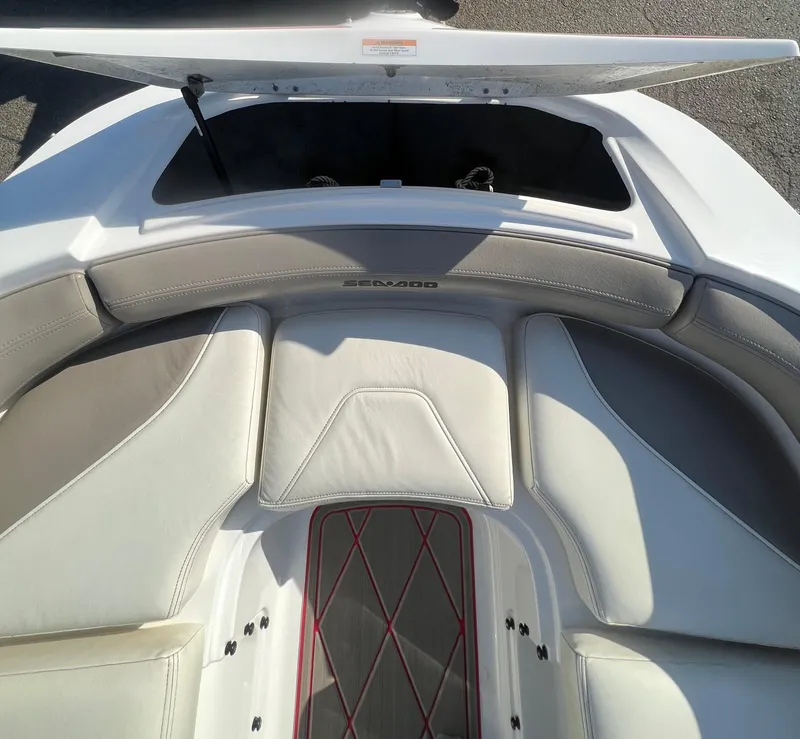 Slide: The Image of 2011 Sea-Doo 230 Wake (510 hp) boat interior with open storage compartment. - 9