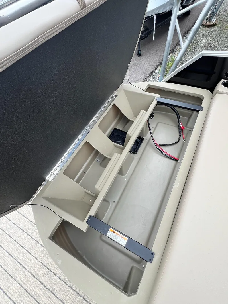 Slide: The Image of Open storage compartment of 2024 Sylvan 8522 CLZ DH Mirage pontoon boat. - 12