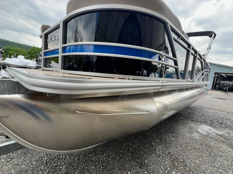 Slide: The Image of 2024 Sylvan 8522 CLZ DH Mirage pontoon boat on gravel lot. - 13