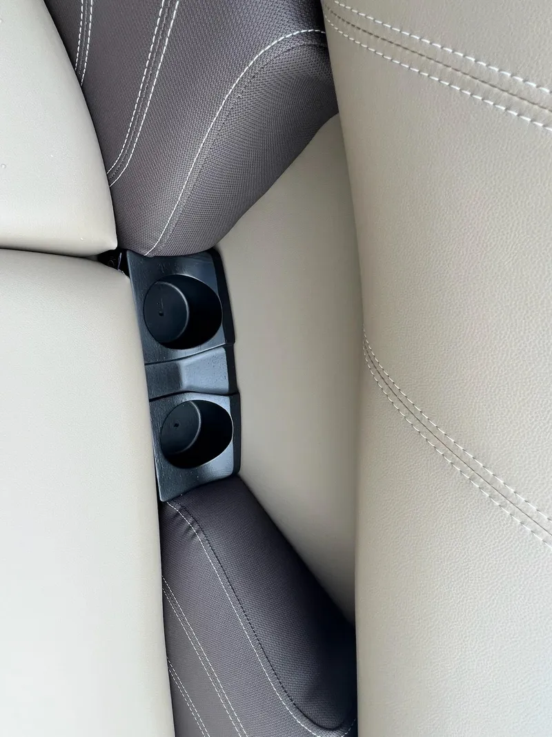 Slide: The Image of Cup holders and beige seats in 2024 Sylvan 8522 CLZ DH Mirage boat. - 14