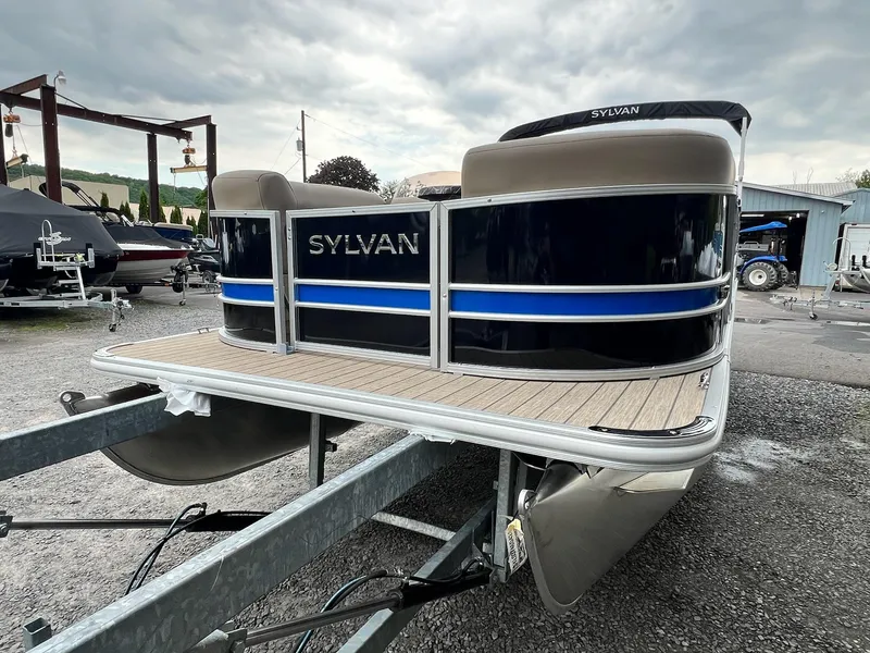 Slide: The Image of 2024 Sylvan 8522 CLZ DH Mirage pontoon boat on trailer, outdoor display. - 16