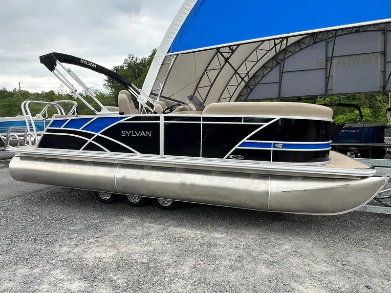 Slide: The Image of 2024 Sylvan 8522 CLZ DH Mirage pontoon boat with blue and black exterior. - 17