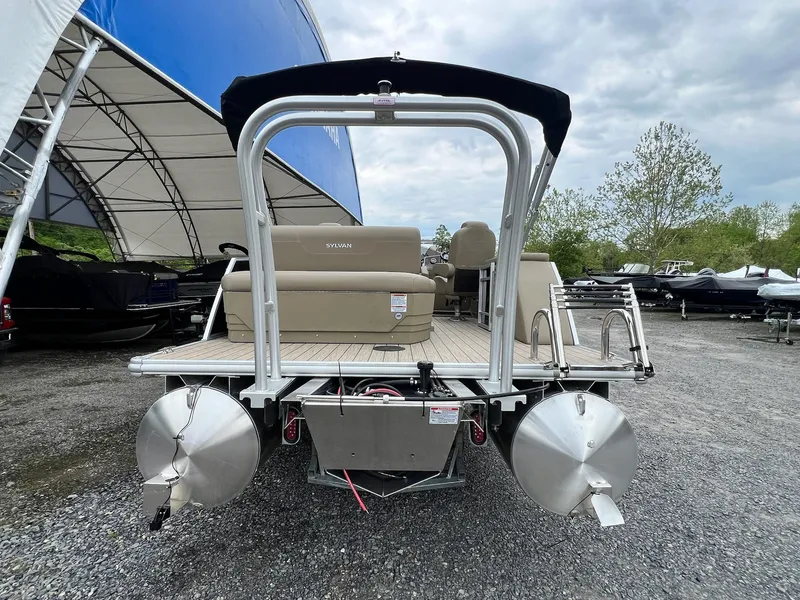 Slide: The Image of 2024 Sylvan 8522 CLZ DH Mirage pontoon boat, rear view, parked outdoors. - 18