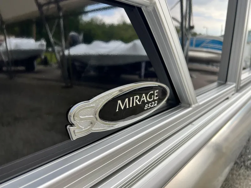 Slide: The Image of Close-up of 2024 Sylvan 8522 CLZ DH Mirage boat emblem. - 21