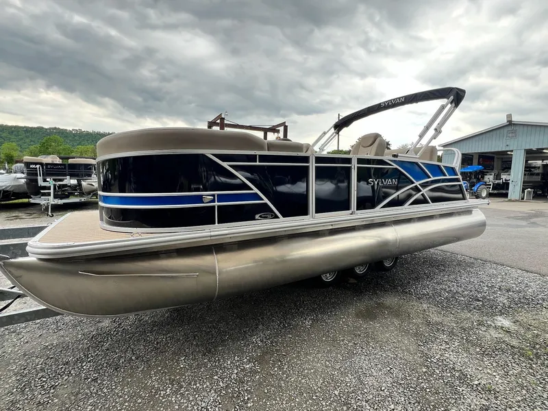 Slide: The Image of 2024 Sylvan 8522 CLZ DH Mirage pontoon boat in a marina. - 31