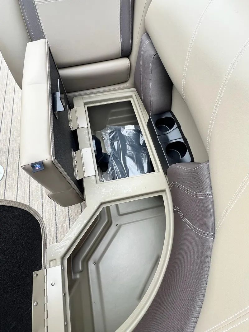 Slide: The Image of 2024 Sylvan 8522 CLZ DH Mirage boat seat storage compartment with cup holders. - 37