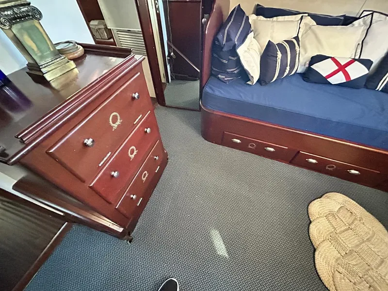 Slide: The Image of Interior cabin of a 1930 Classic ACF 47' Motor Yacht with wooden furniture and nautical-themed decor. - 22