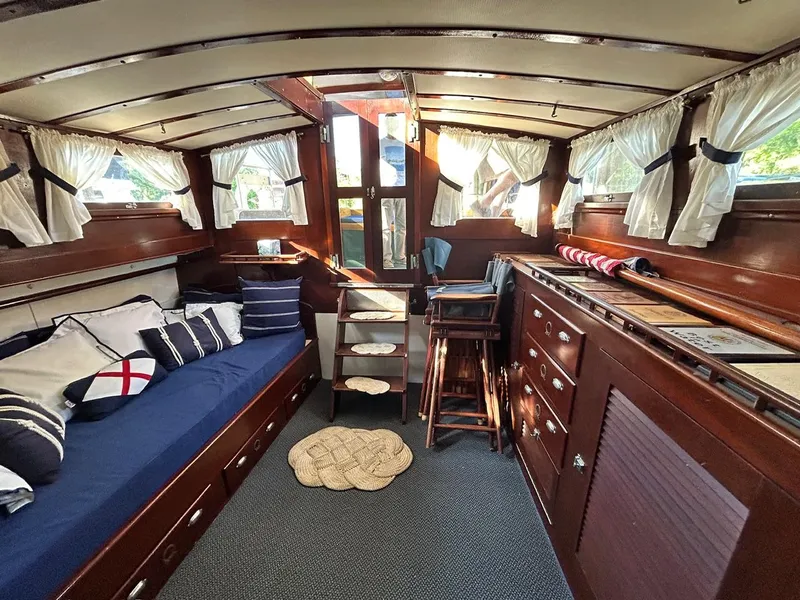 Slide: The Image of Interior of a 1930 Classic ACF 47' Motor Yacht with wooden furnishings and nautical decor. - 26