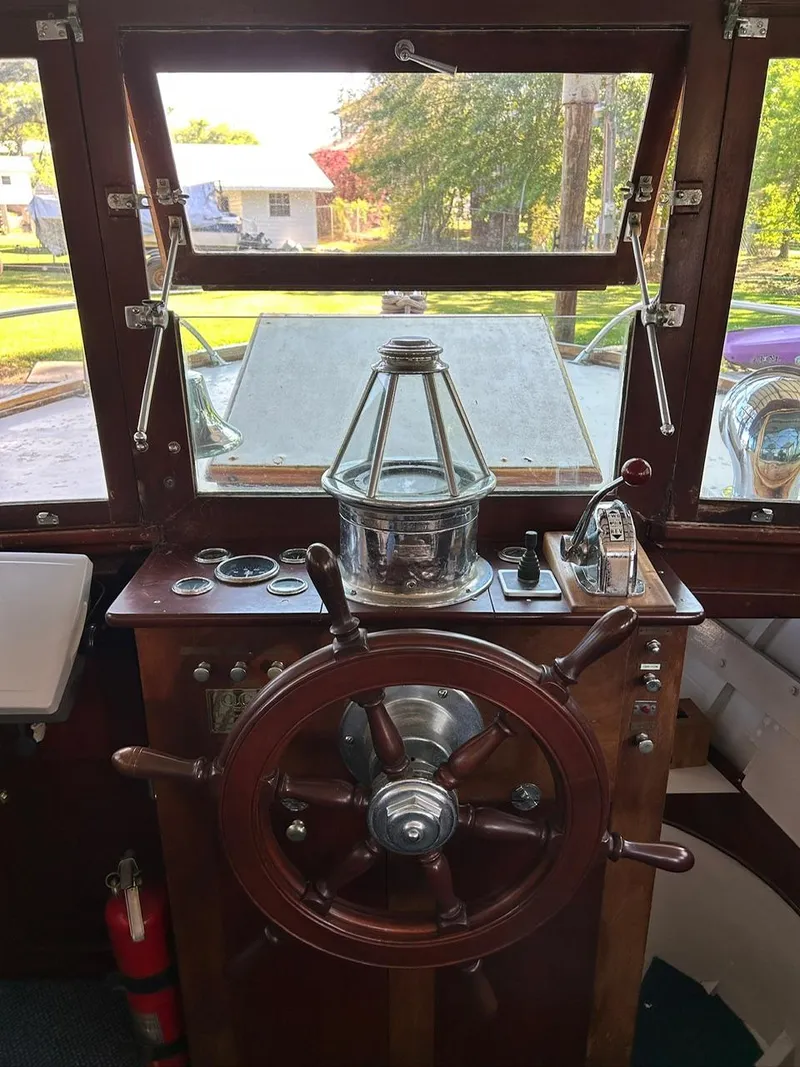 Slide: The Image of Classic 1930 ACF 47' Motor Yacht helm with wooden wheel and vintage controls. - 38