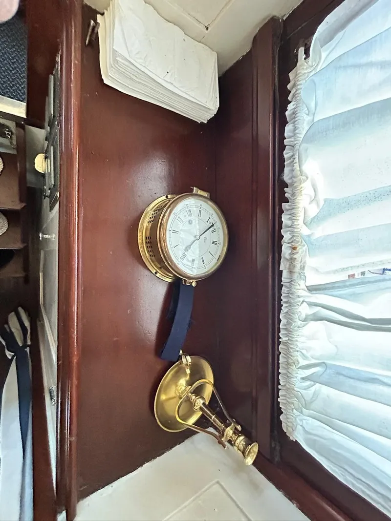 Slide: The Image of Interior of 1930 Classic ACF 47' Motor Yacht with brass clock and lamp. - 31