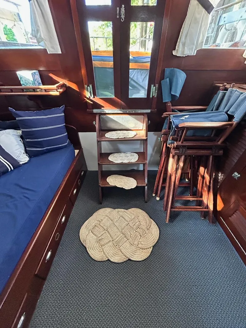 Slide: The Image of Interior of a 1930 Classic ACF 47' Motor Yacht with wooden furniture and nautical decor. - 19