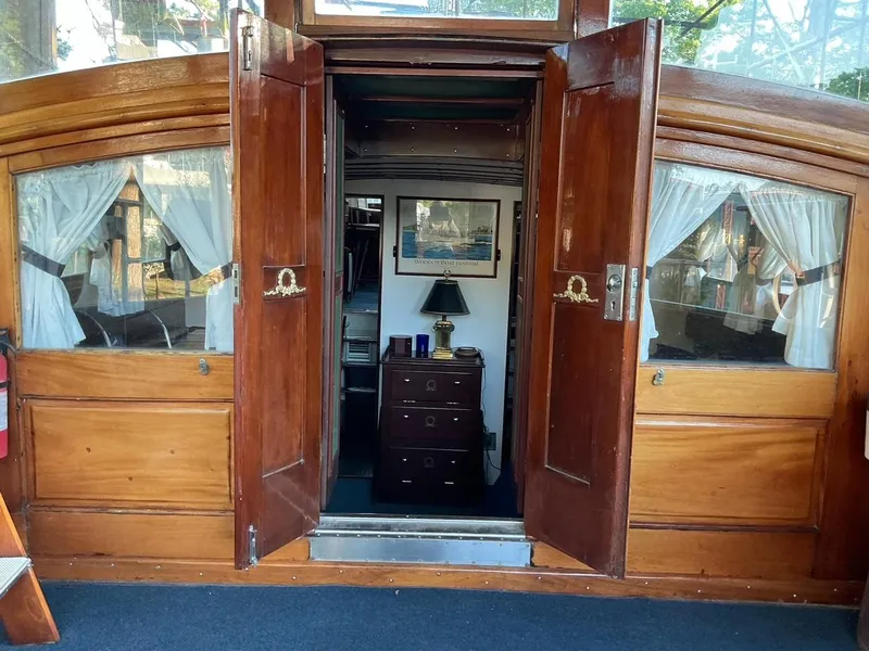 Slide: The Image of Interior view of 1930 Classic ACF 47' Motor Yacht with wooden doors and vintage decor. - 4