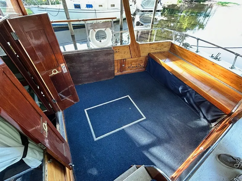Slide: The Image of Interior of 1930 Classic ACF 47' Motor Yacht with wooden finishes and blue carpet. - 6