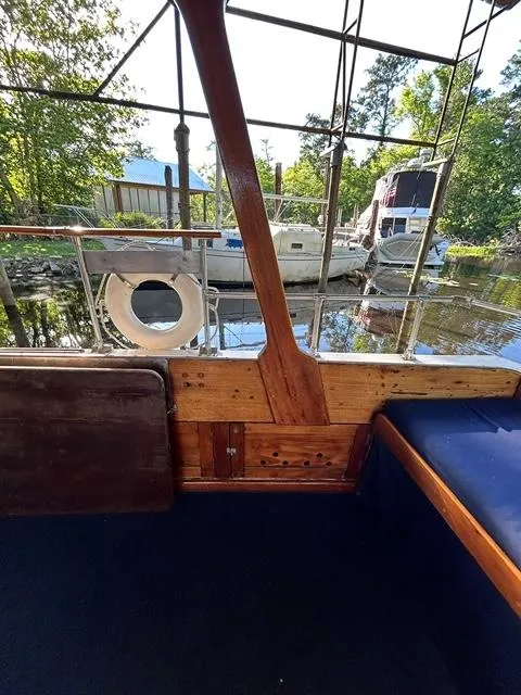 Slide: The Image of Interior view of 1930 Classic ACF 47' Motor Yacht docked by the water. - 14