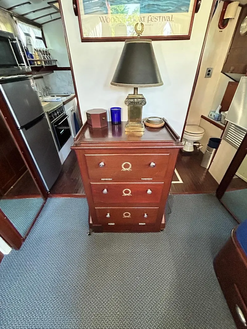 Slide: The Image of Interior of 1930 Classic ACF 47' Motor Yacht with wooden furniture and kitchen area. - 23