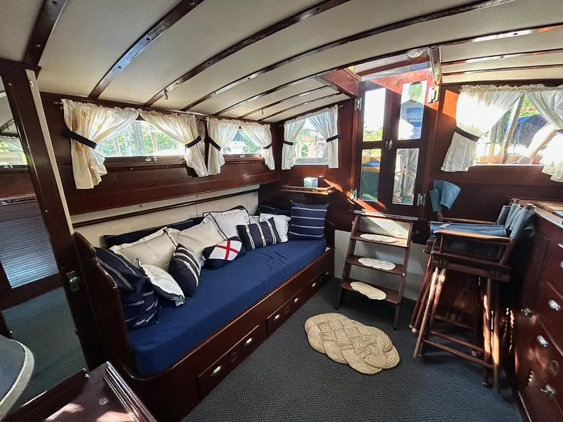 Slide: The Image of Interior of 1930 Classic ACF 47' Motor Yacht with cozy seating and nautical decor. - 25