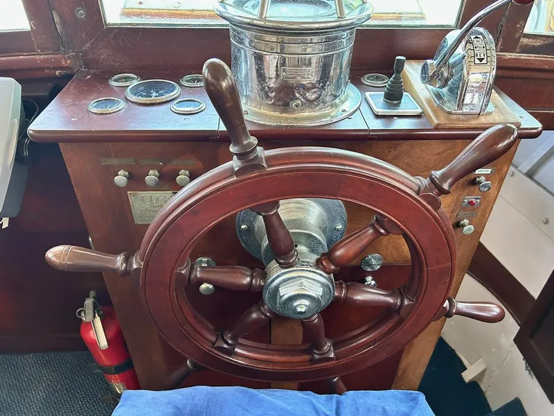 Slide: The Image of Vintage helm of a 1930 Classic ACF 47' Motor Yacht with wooden steering wheel. - 36