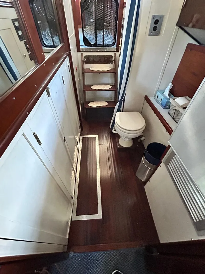 Slide: The Image of Interior of 1930 Classic ACF 47' Motor Yacht with wooden flooring and compact bathroom. - 33