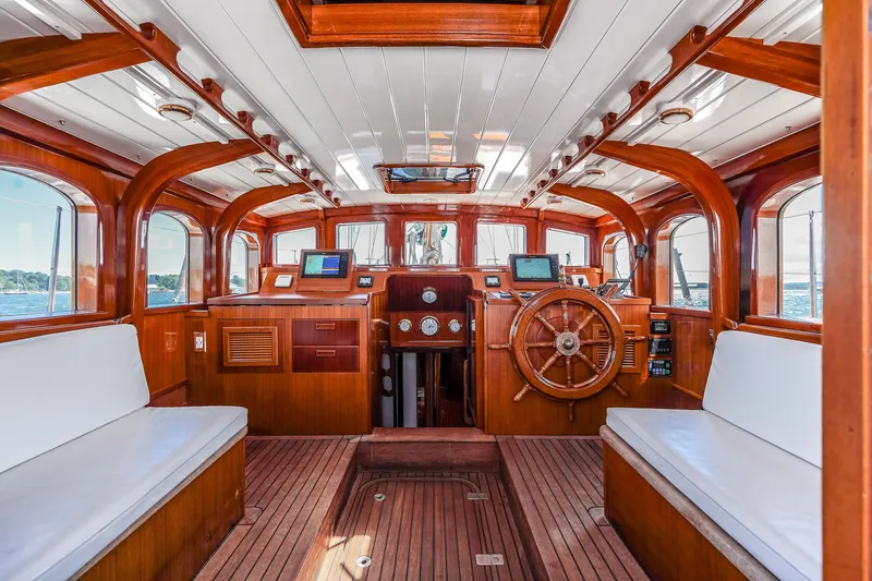 Slide: The Image of Interior of 1929 Lyman-Morse Staysail Schooner with wooden finish and nautical instruments. - 20