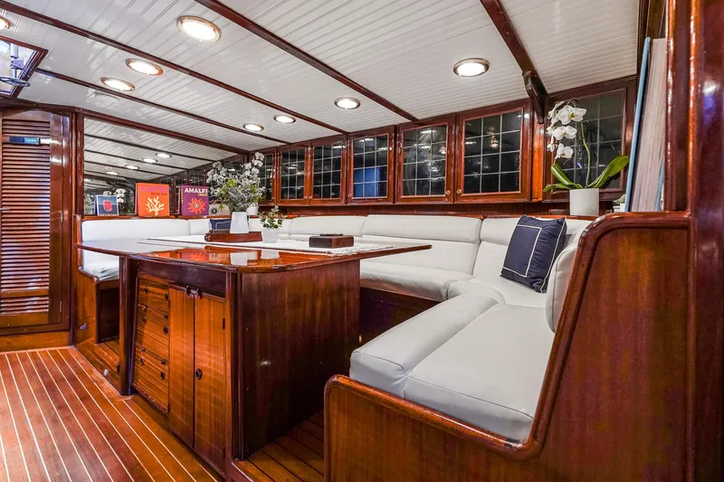 Slide: The Image of Luxurious 1929 Lyman-Morse Staysail Schooner interior with elegant wood finish and plush seating. - 27