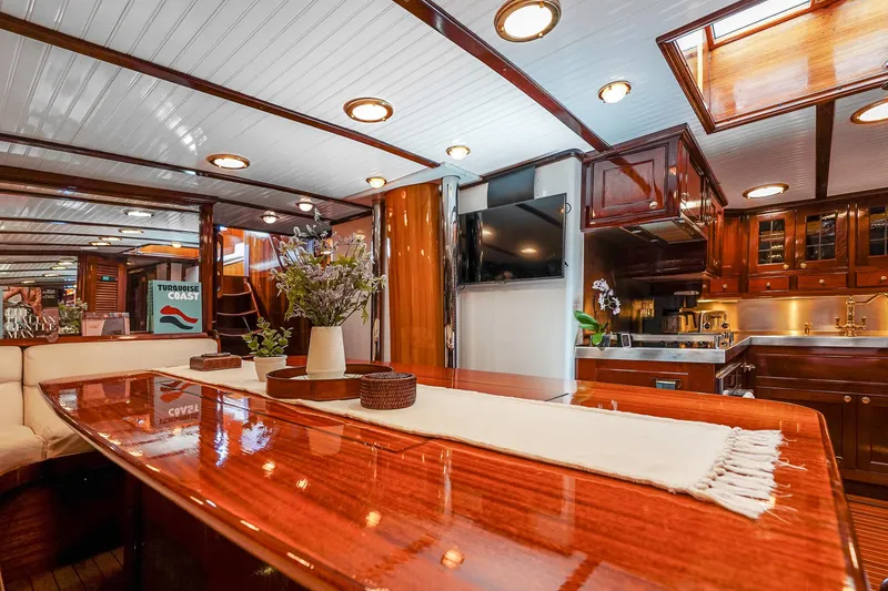 Slide: The Image of Luxurious interior of 1929 Lyman-Morse Staysail Schooner with polished wood and modern amenities. - 31